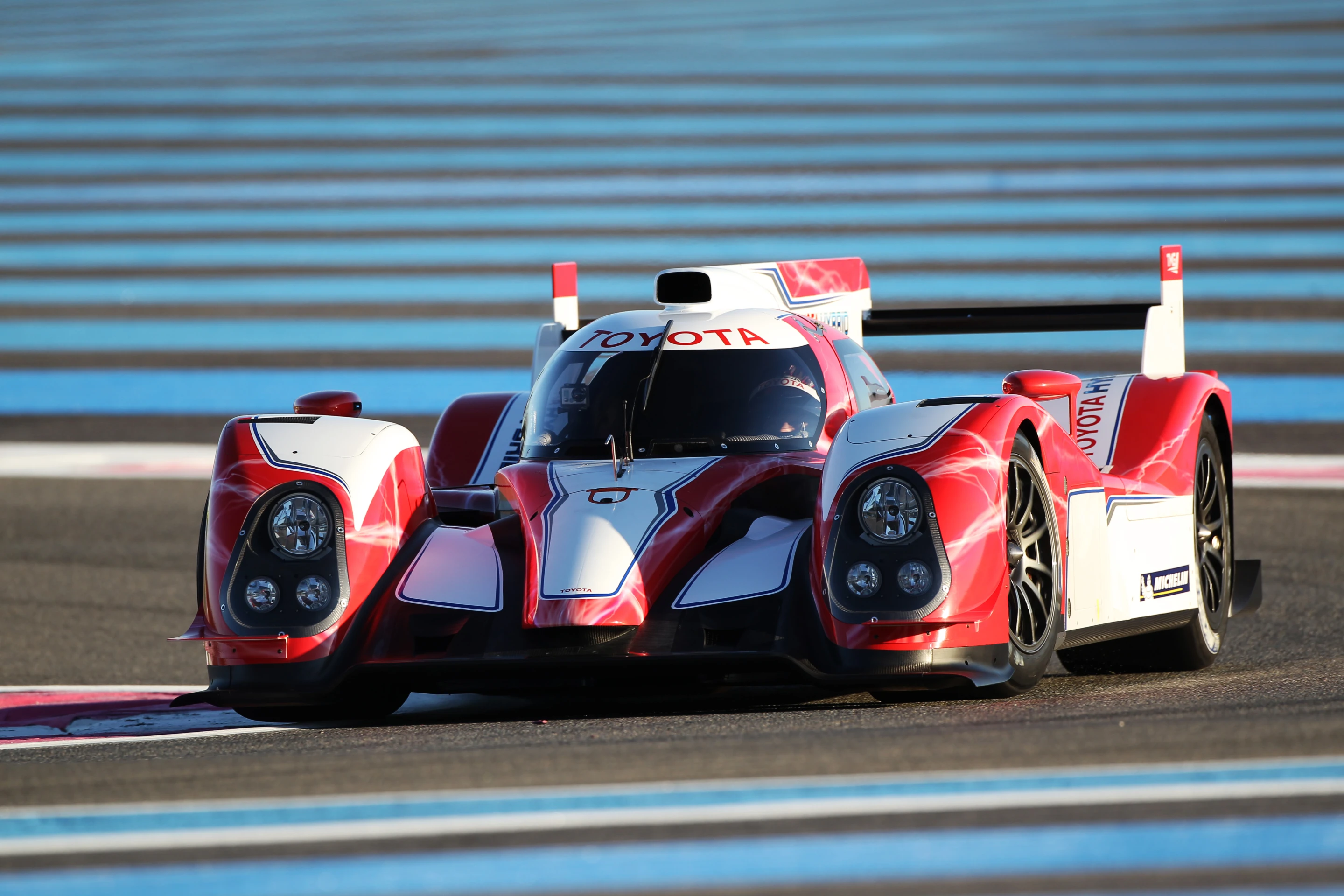 Toyota's TS030 Hybrid sports car on track at the Paul Ricard circuit.