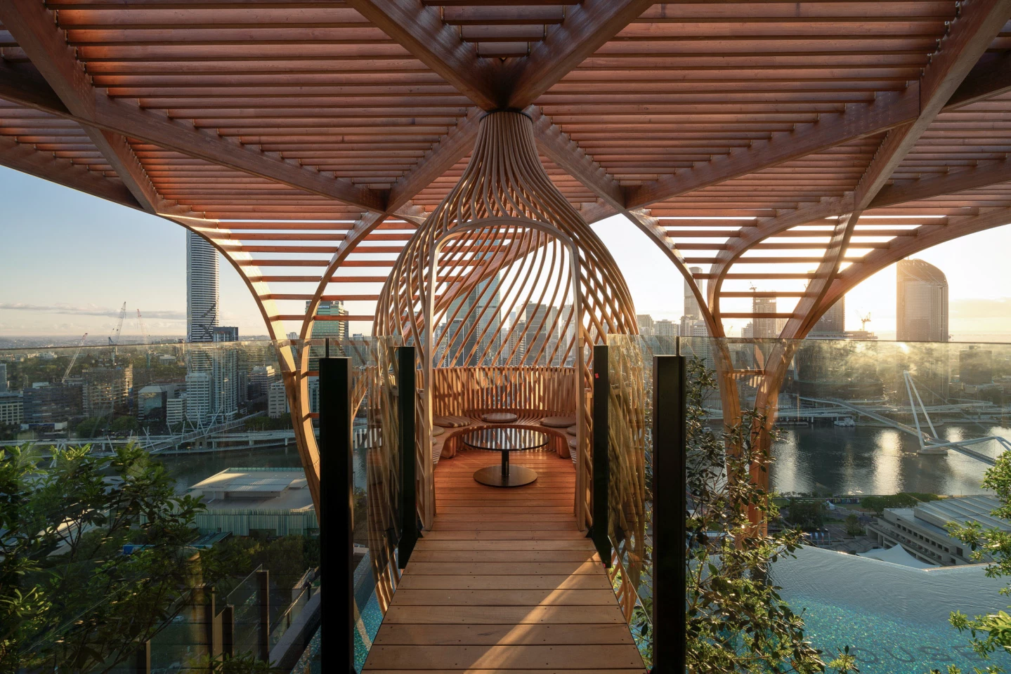 Upper House includes two timber "nest" structures that are made from 92 steam-bent ash ribs and offer a pleasant place for residents to relax