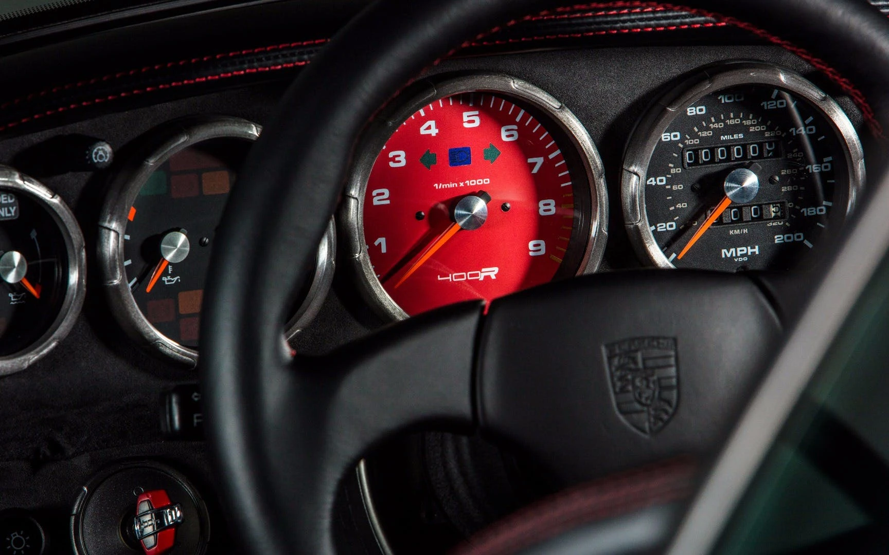 The classic 911 gauge cluster has been tastefully modified for the 400R