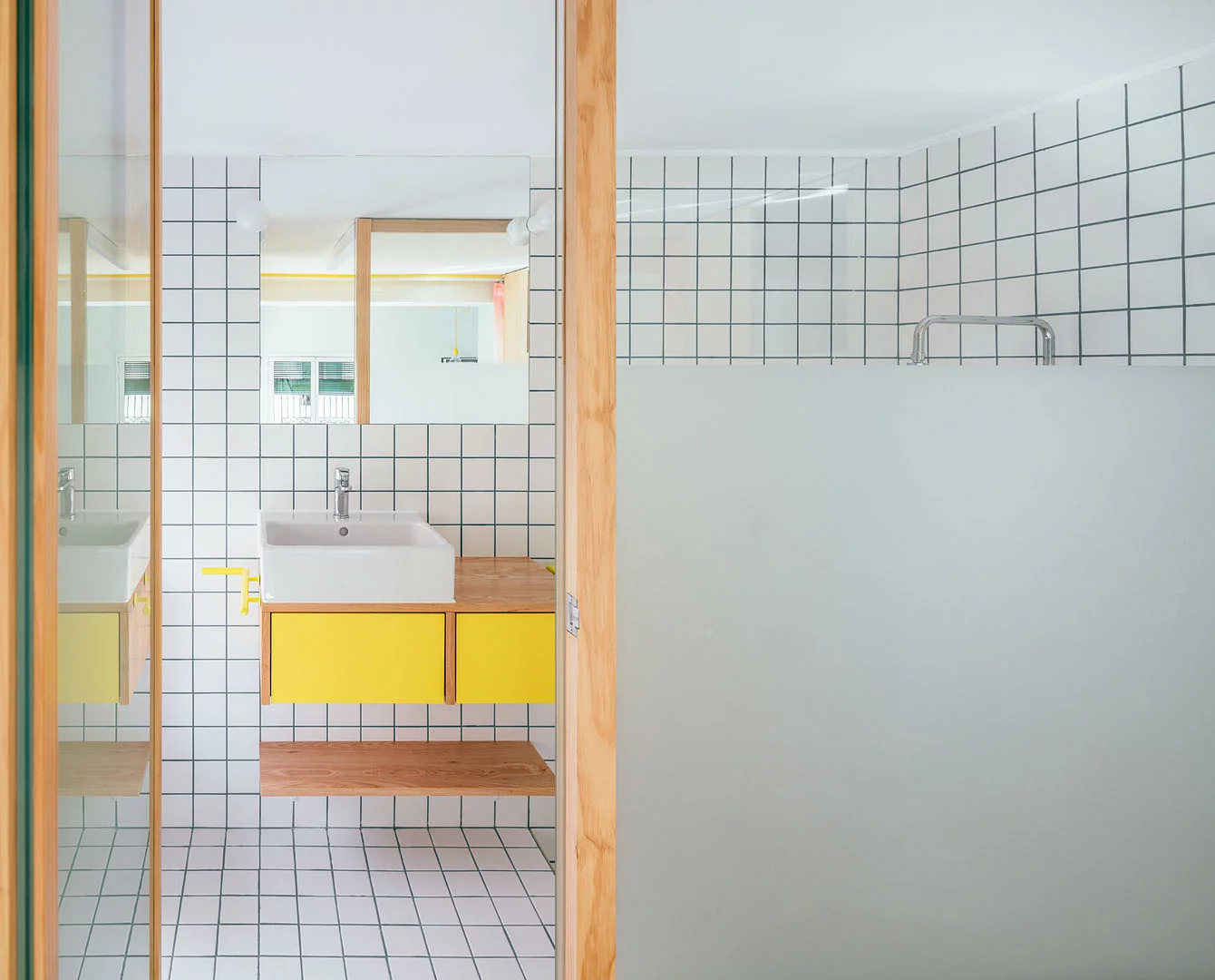 The bathroom is smartly tucked away at the back of the unit