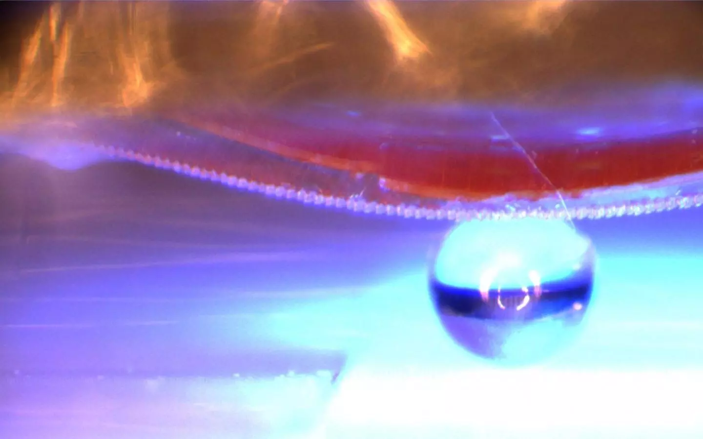 The material is used to lift a 1-mm diameter glass sphere