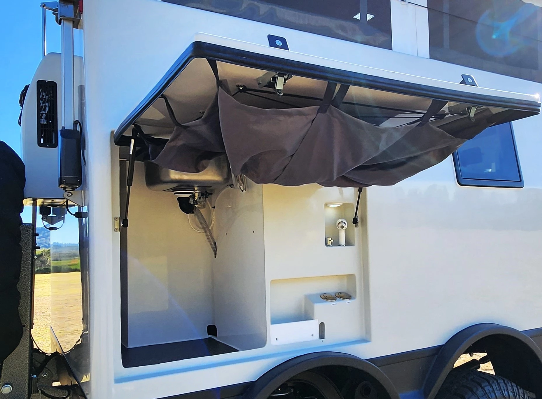 Outdoor shower with dropdown curtain