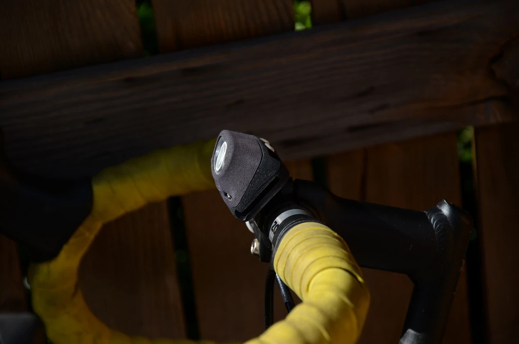 Bike mounting hardware transforms headlamp to bike light
