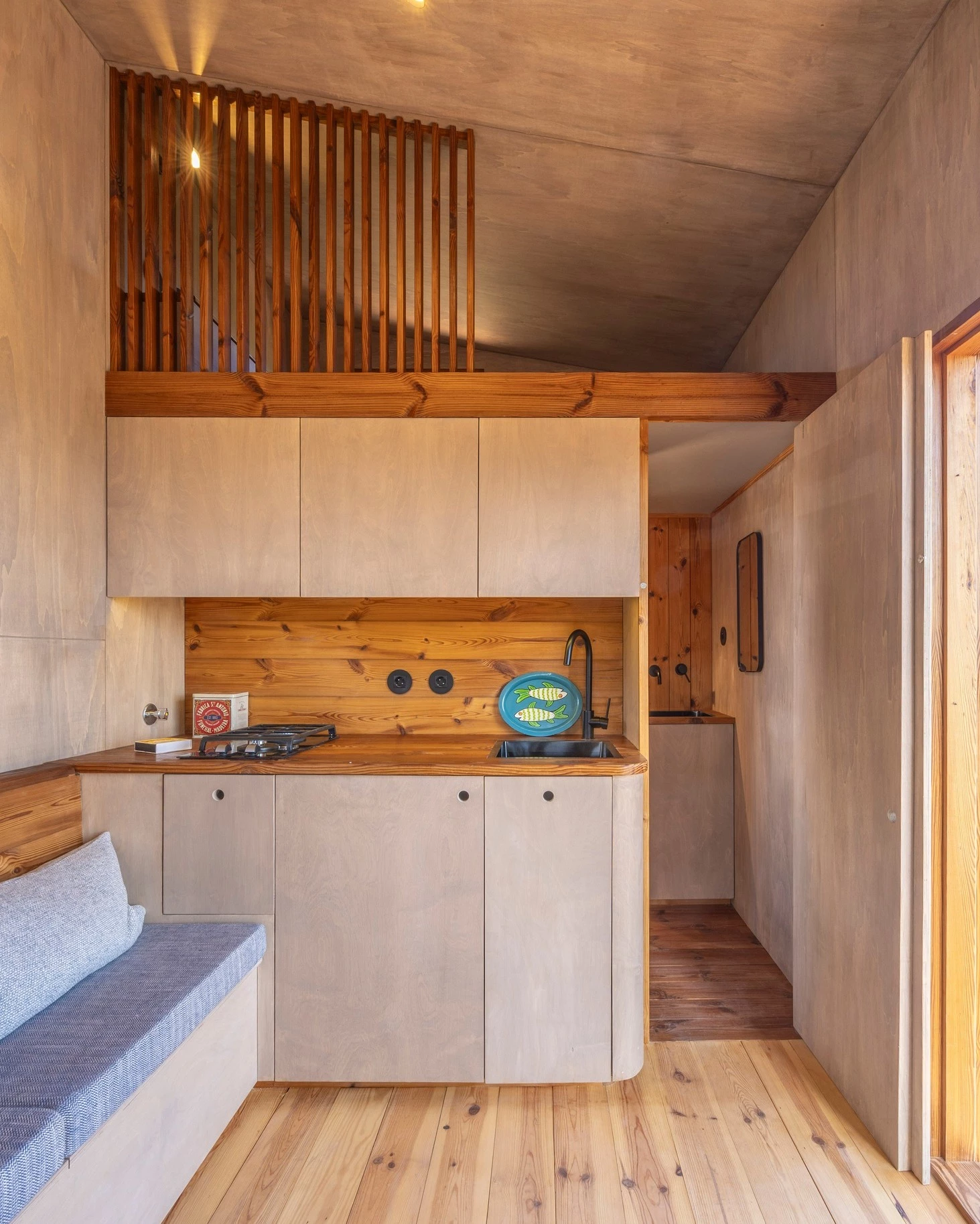 The Barca includes a small and simple kitchen with a propane-powered two-burner stove, reflecting its use as a vacation home