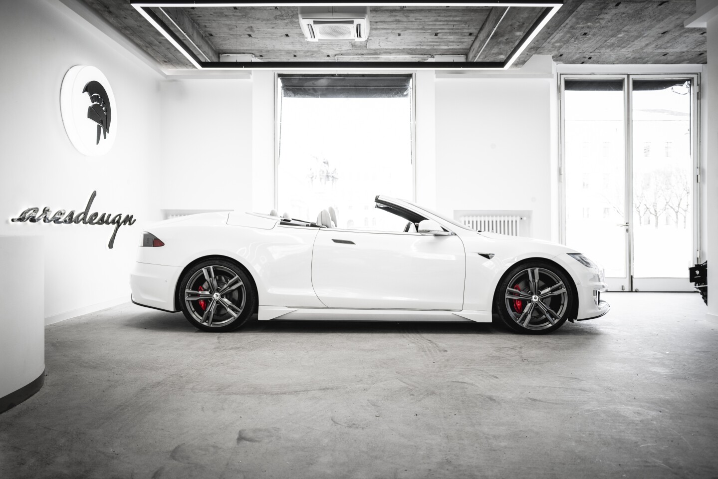 Ares makes four doors into two in creating a Model S convertible