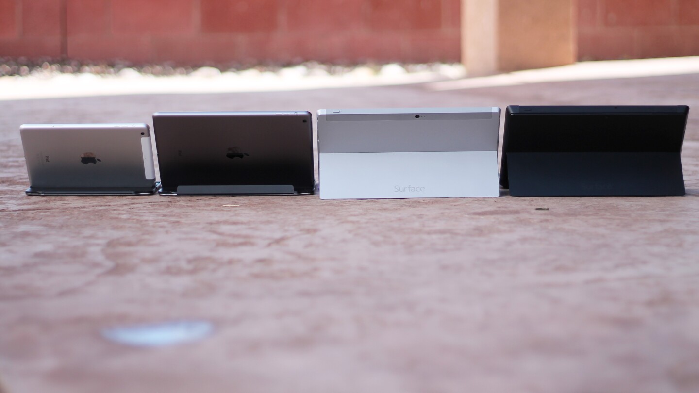 The backsides of (left-right) the Retina iPad mini, iPad Air, Surface 2, and Surface Pro 2