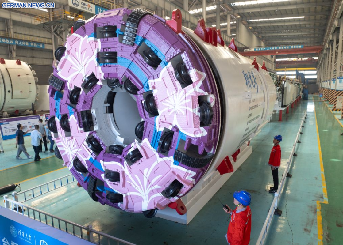 China's colossal tunneling machine bores AND blasts through raw ground