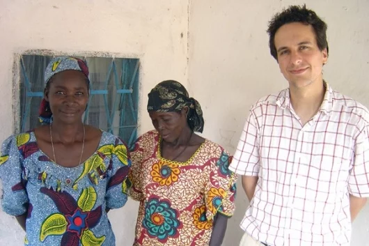 Researcher Thomas Fritz with two of the Mafa women who participated in his music study to demonstrate music conveys emotion across cultures