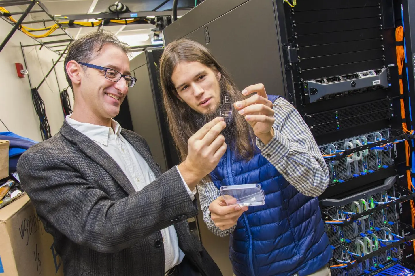 Worcester's Prof. Erkan Tüzel (left) and PhD candidate James Kingsley examine the SPARTAN device