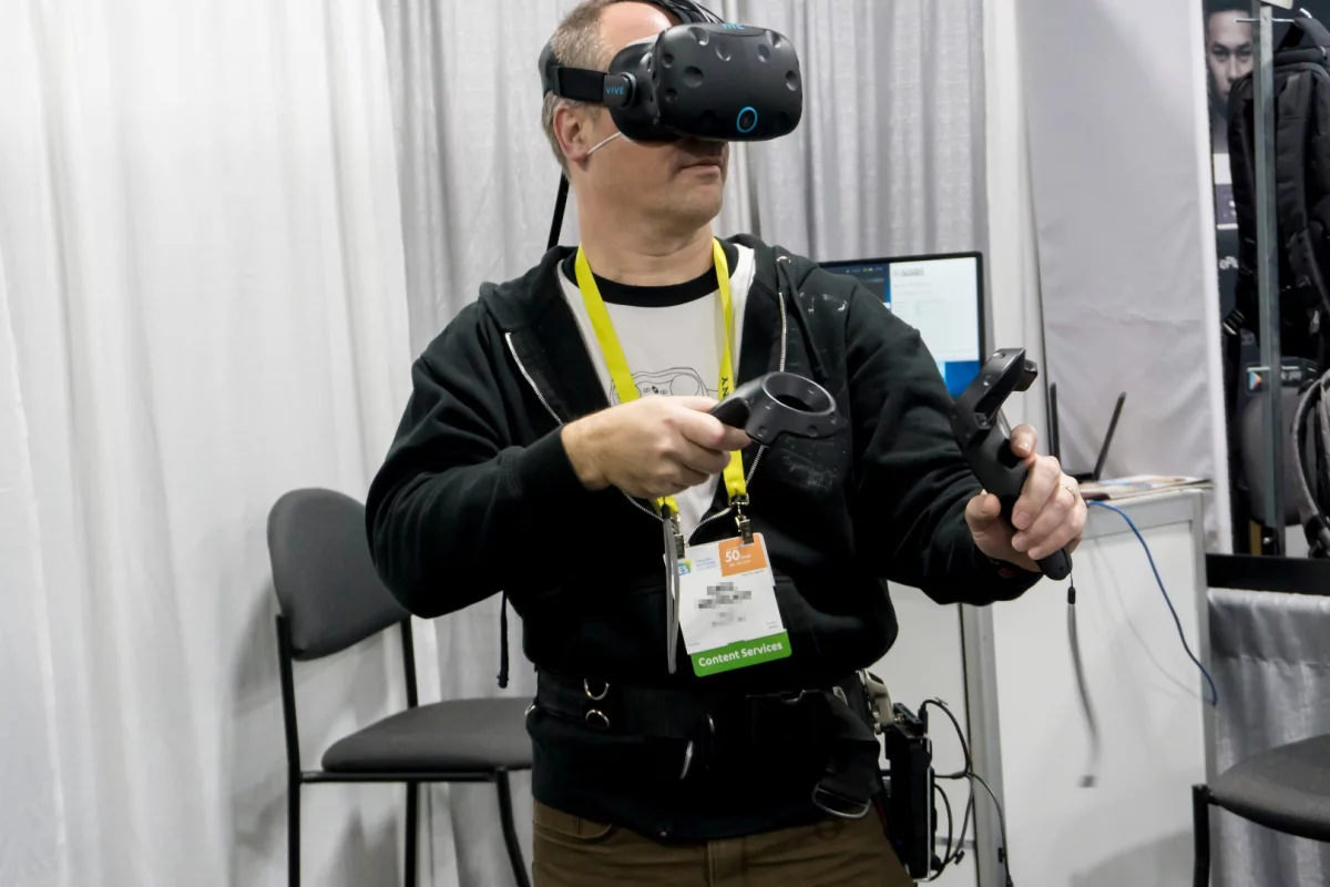 A CES attendee demoing KwikVR's wireless adapter for the HTC Vive and Oculus Rift