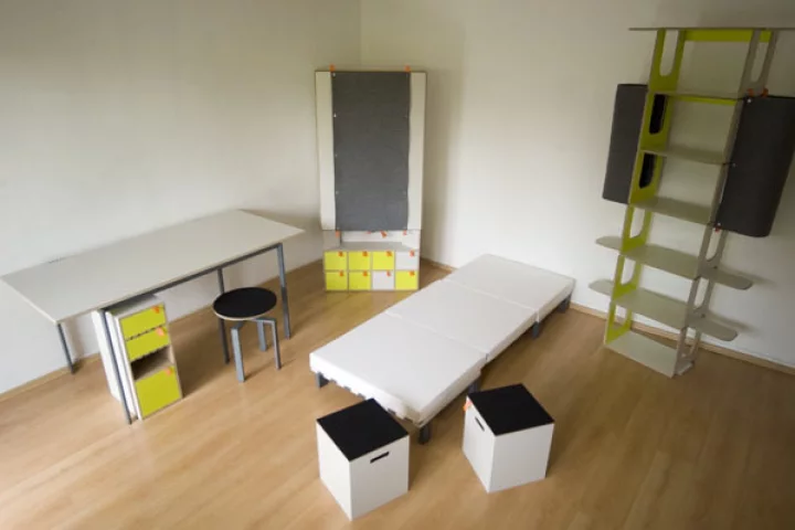 Casulo contains an armoire cupboard, desk table and cabinet, height-adjustable revolving chair, two stools and a bed with mattress