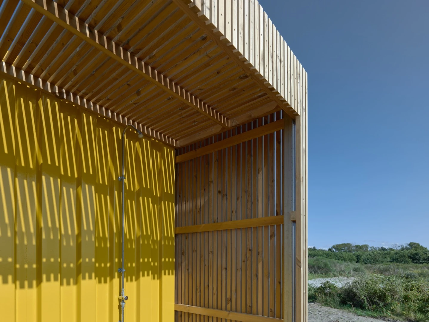 The Water Sports Center Halsskov's facilities building is lined with heat-treated sustainably-sourced wood