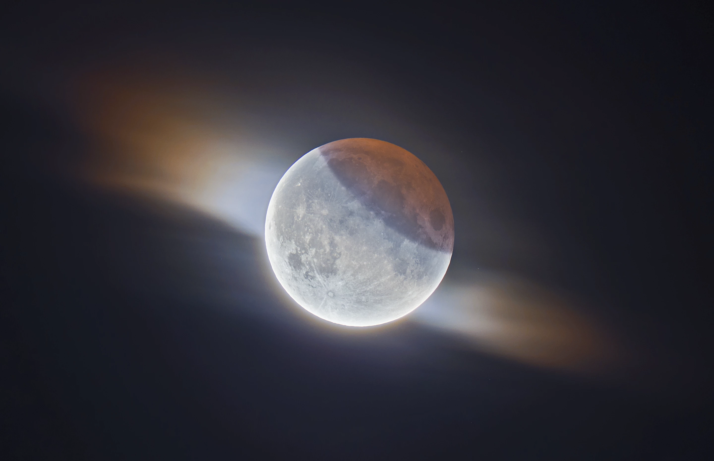 Runner Up - Our Moon. Partial Lunar Eclipse With Clouds. During the 2019 partial lunar eclipse, the photographer managed to capture this fantastic image of the Moon while a small cloud passed in front of it
