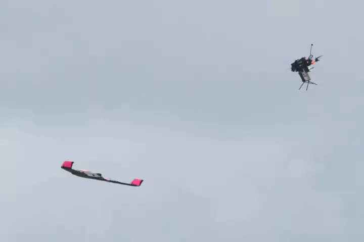 Quadcopter with Claymore (right) engages SkyRaider drone
