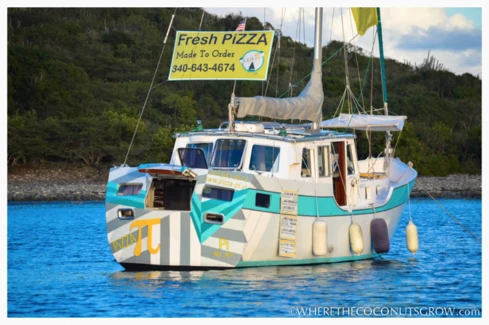 Sasha and Tara Bouis have transformed an abandoned aluminum sailboat into a floating pizza shop