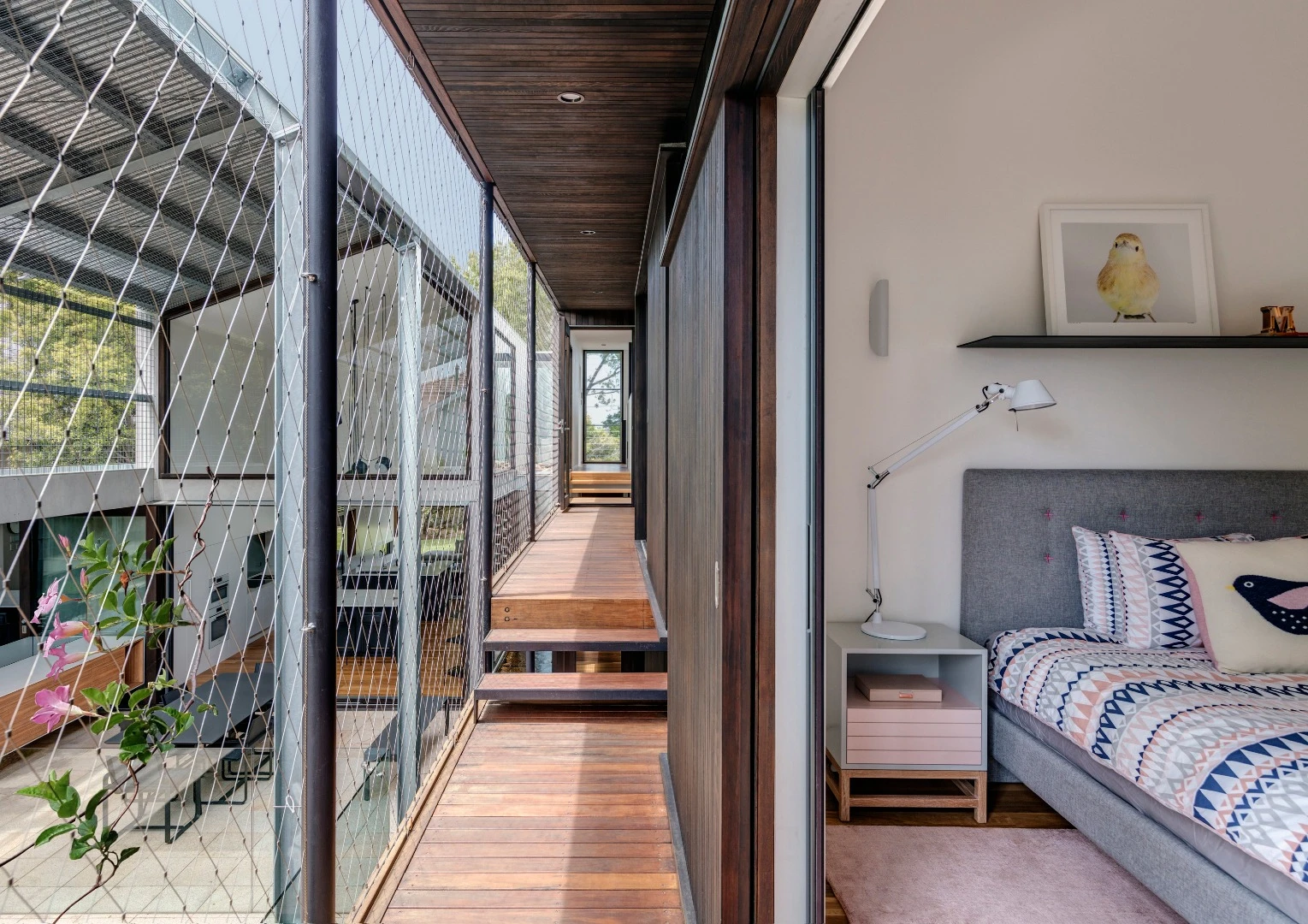 The Iron Maiden House in Sydney features elevated outdoor walkways that overlook the pool below