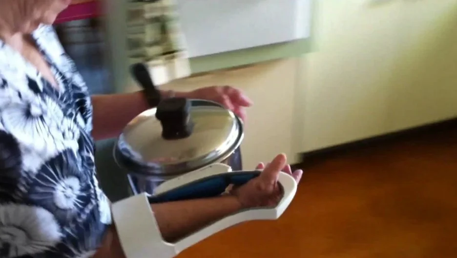 The Arthritis Handle is said to offer users a more stable, less dangerous way of moving hot cookware around the kitchen