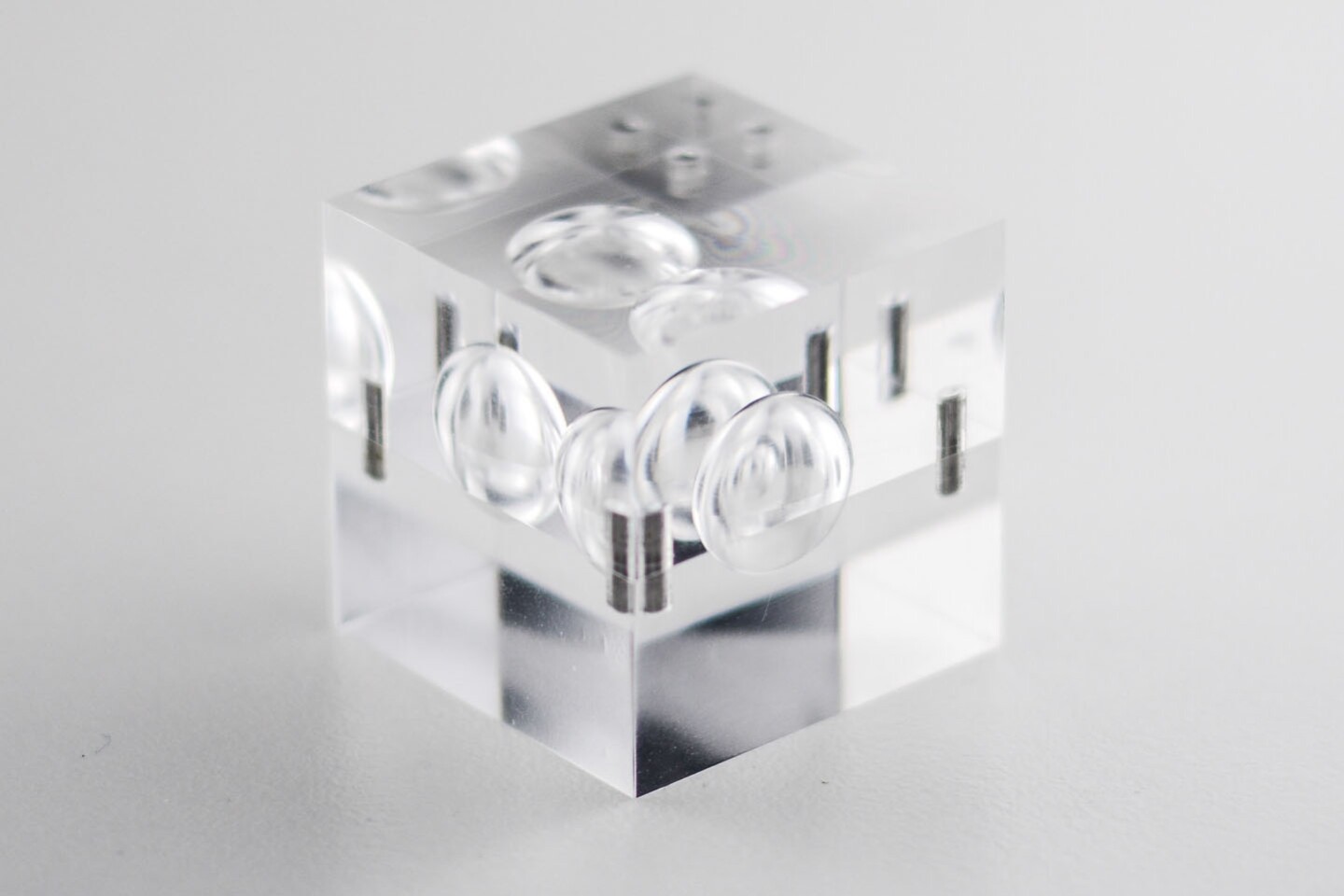 Complex target designs place multiple cavities around fuel pellets, positioned to precisely tune the shockwaves that result when a hypersonic projectile hits it