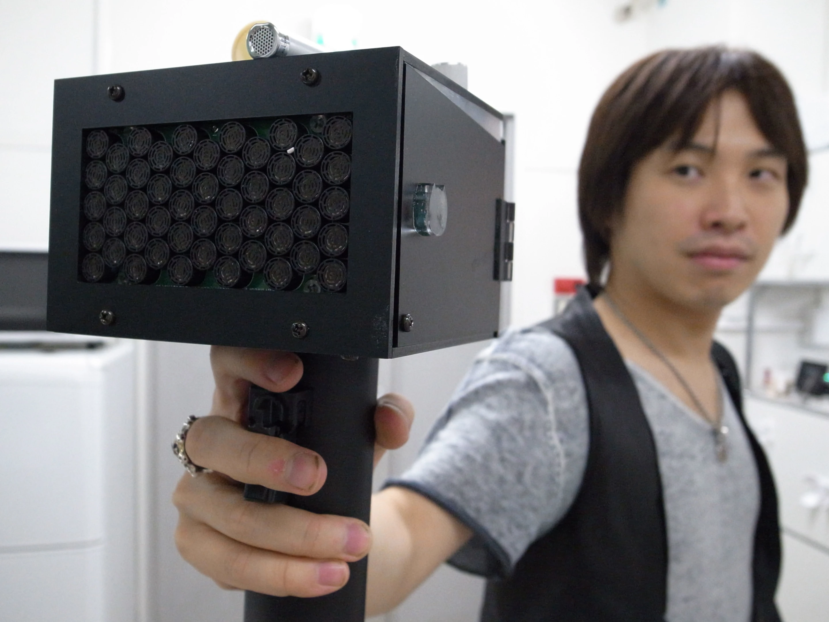 A Japanese team has invented a portable device that painlessly causes people to stop talking