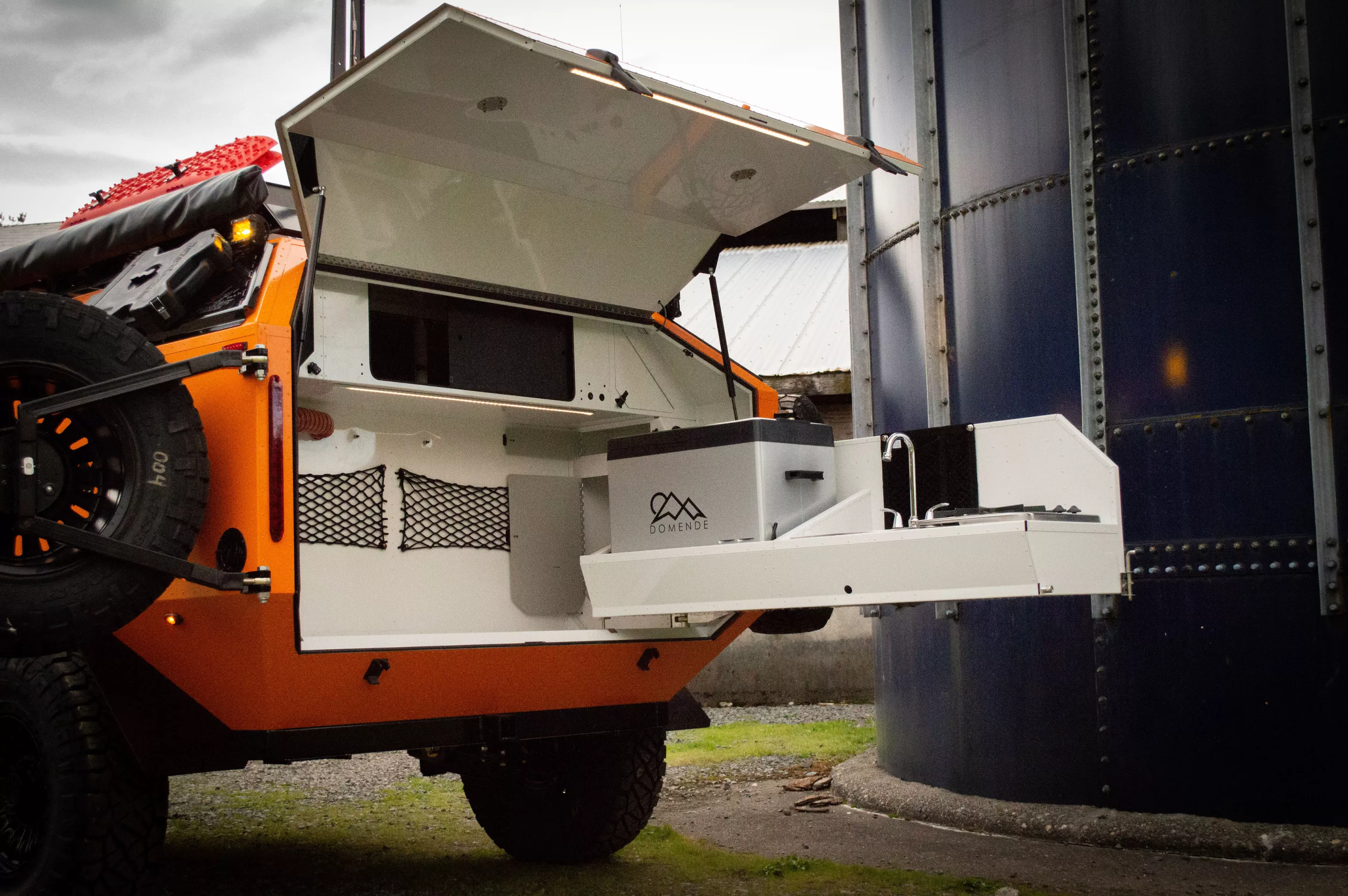 The ELE has the same style of swing-out tailgate kitchen as the original Mammoth trailer