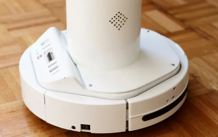 The robot is mounted on a wheelbase with servos and is free to move about