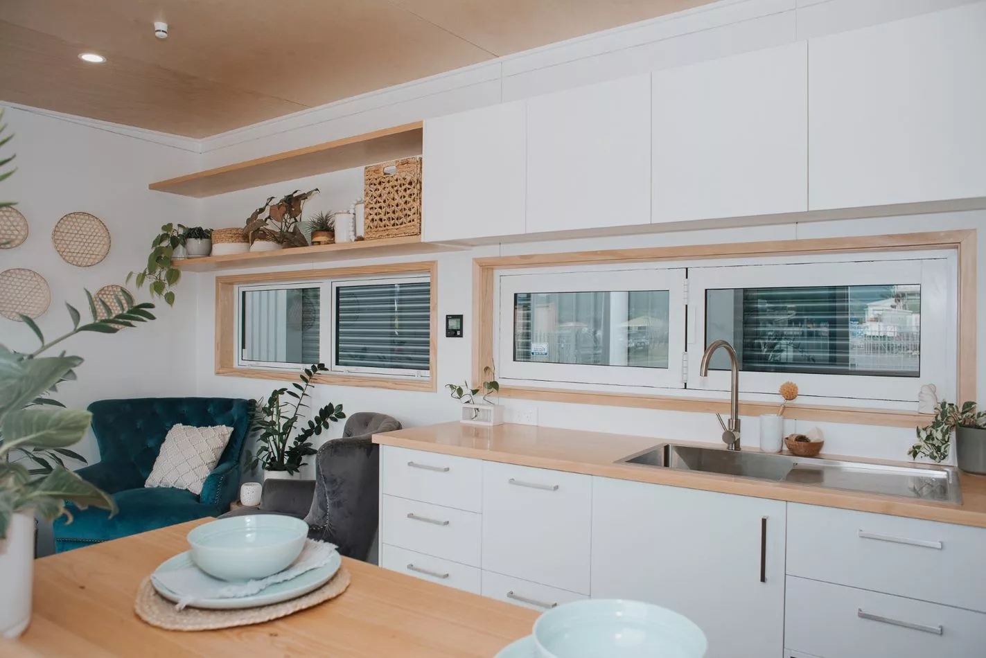 The Kōtuku's kitchen features quite a lot of storage space, including overhead cabinets