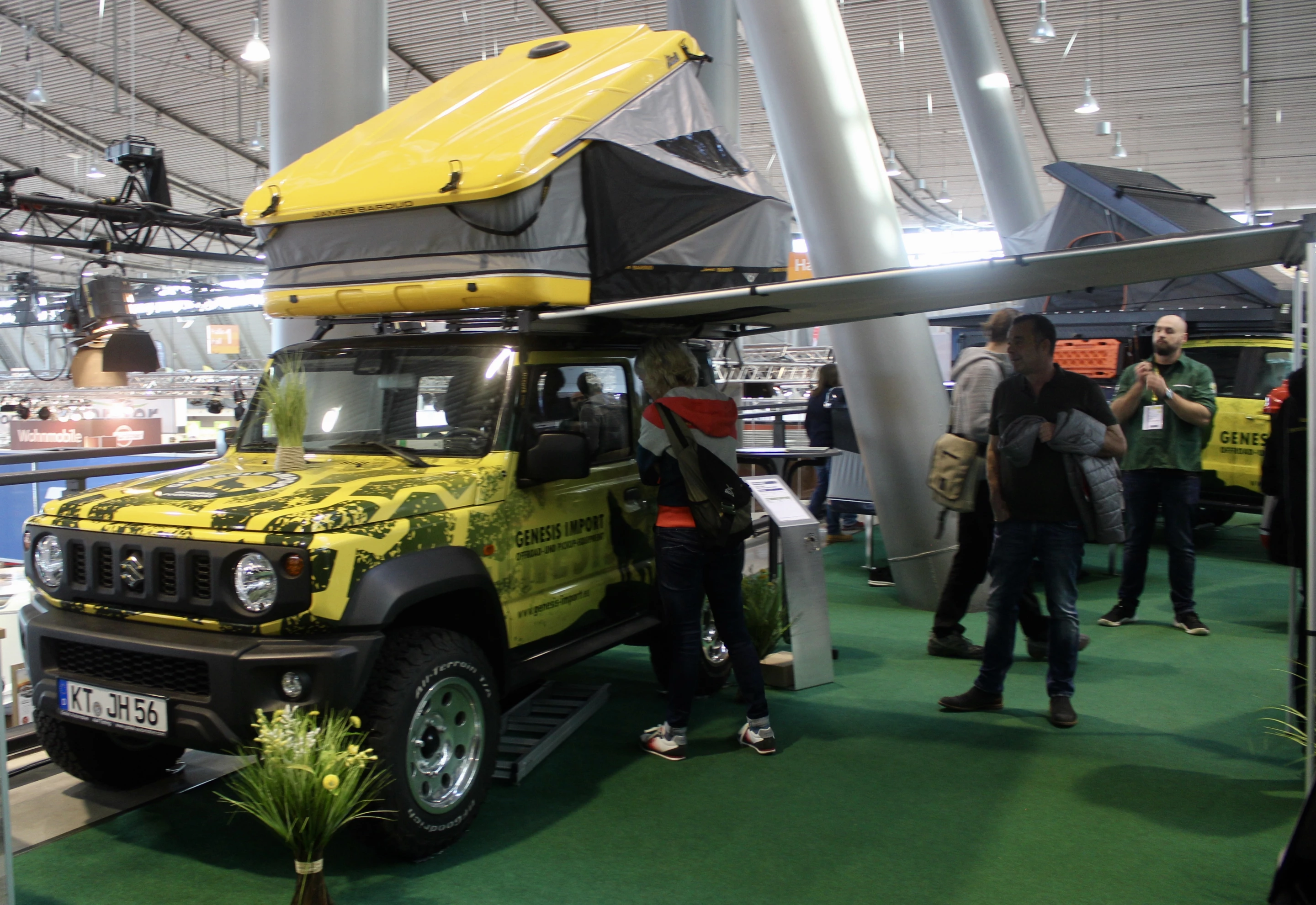 Our favorite overland rig of the show, a Suzuki Jimney with a hardshell roof-top tent and awning, on show at the booth of Genesis Imports