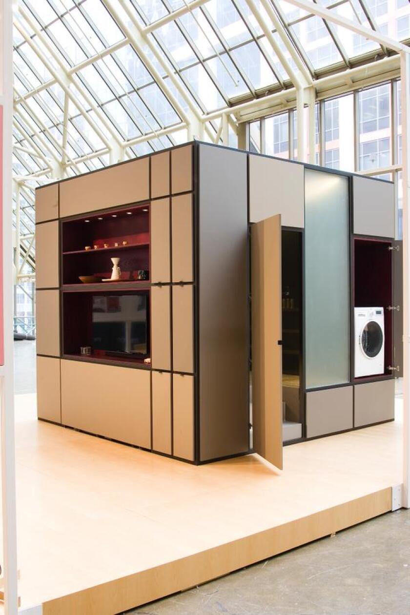 The cube features a hidden European laundry and access to the bathroom which is located inside the structure of the Cubitat