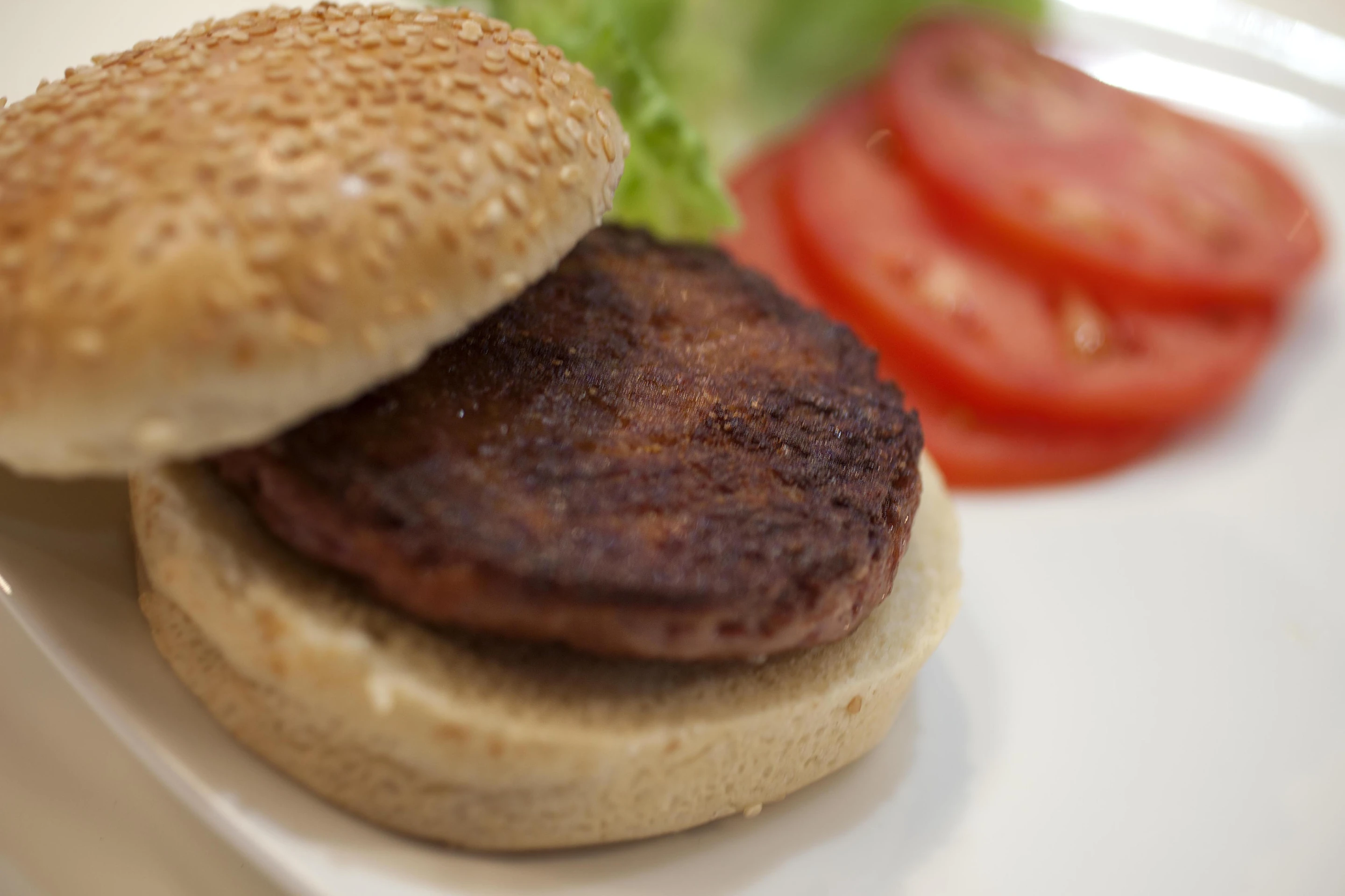 The lab-grown burger was served with the usual trappings for presentation purposes
