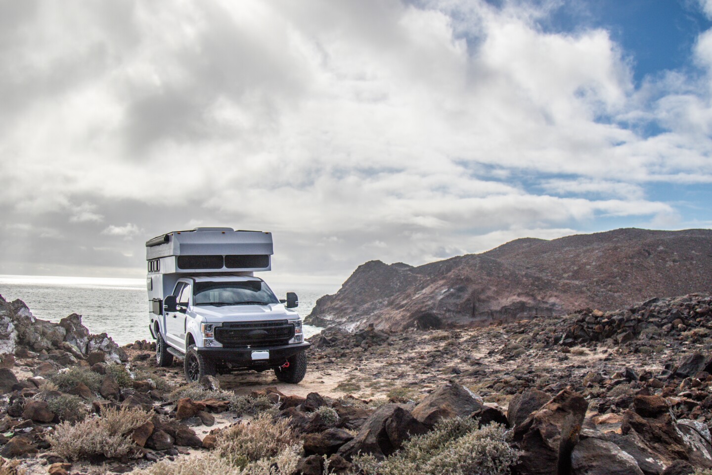 The actuated roof lifts to add roughly a foot of extra headroom at camp