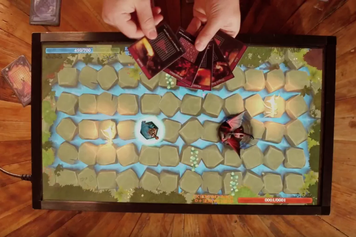 PlayTable is a gaming console that can be played using physical game pieces, or users' mobile phones