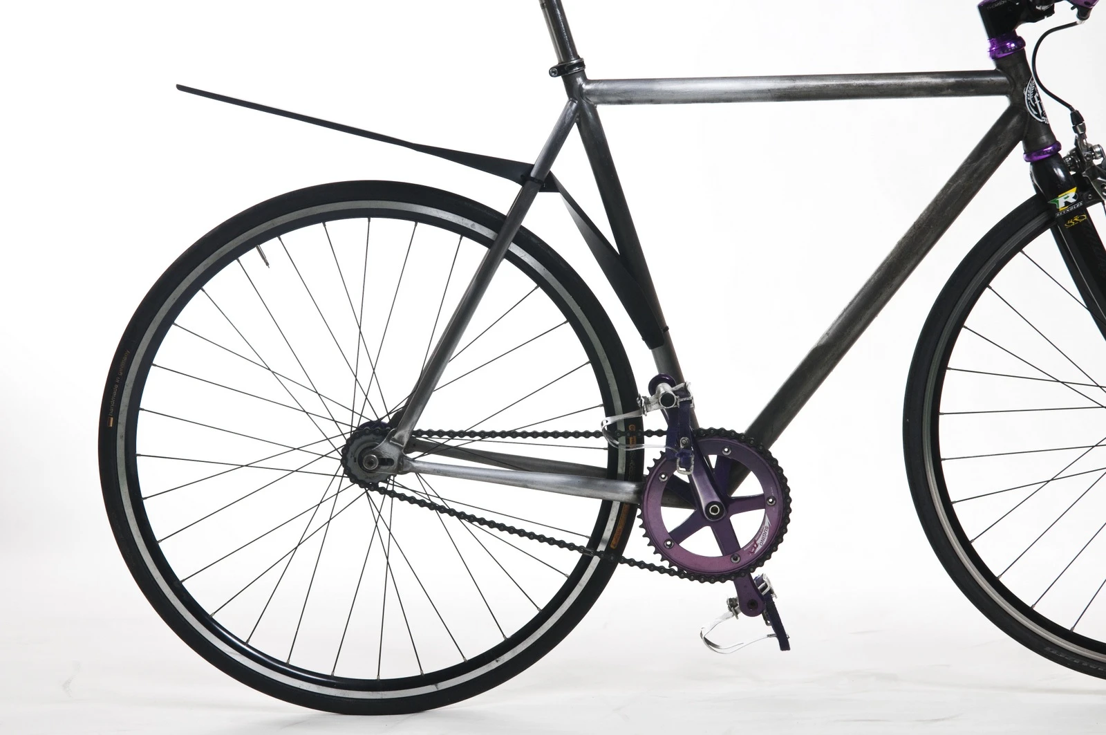 The QuickFix mudguard attaches to a bike in seconds, and packs flat when not in use