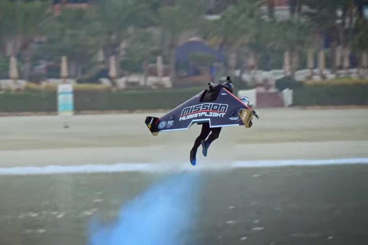 Jetman pilot Vince Reffet takes off from the ground before soaring off into the distance in a world-first transition from VTOL to winged flight