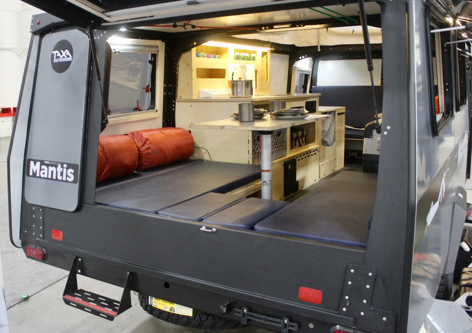 After initially focusing on small and smaller, Taxa went bigger with its latest release, the 18-foot (5.5-m) Mantis. This soon-to-launch updated model includes the new rear hatch and an extra berth, sleeping up to five people