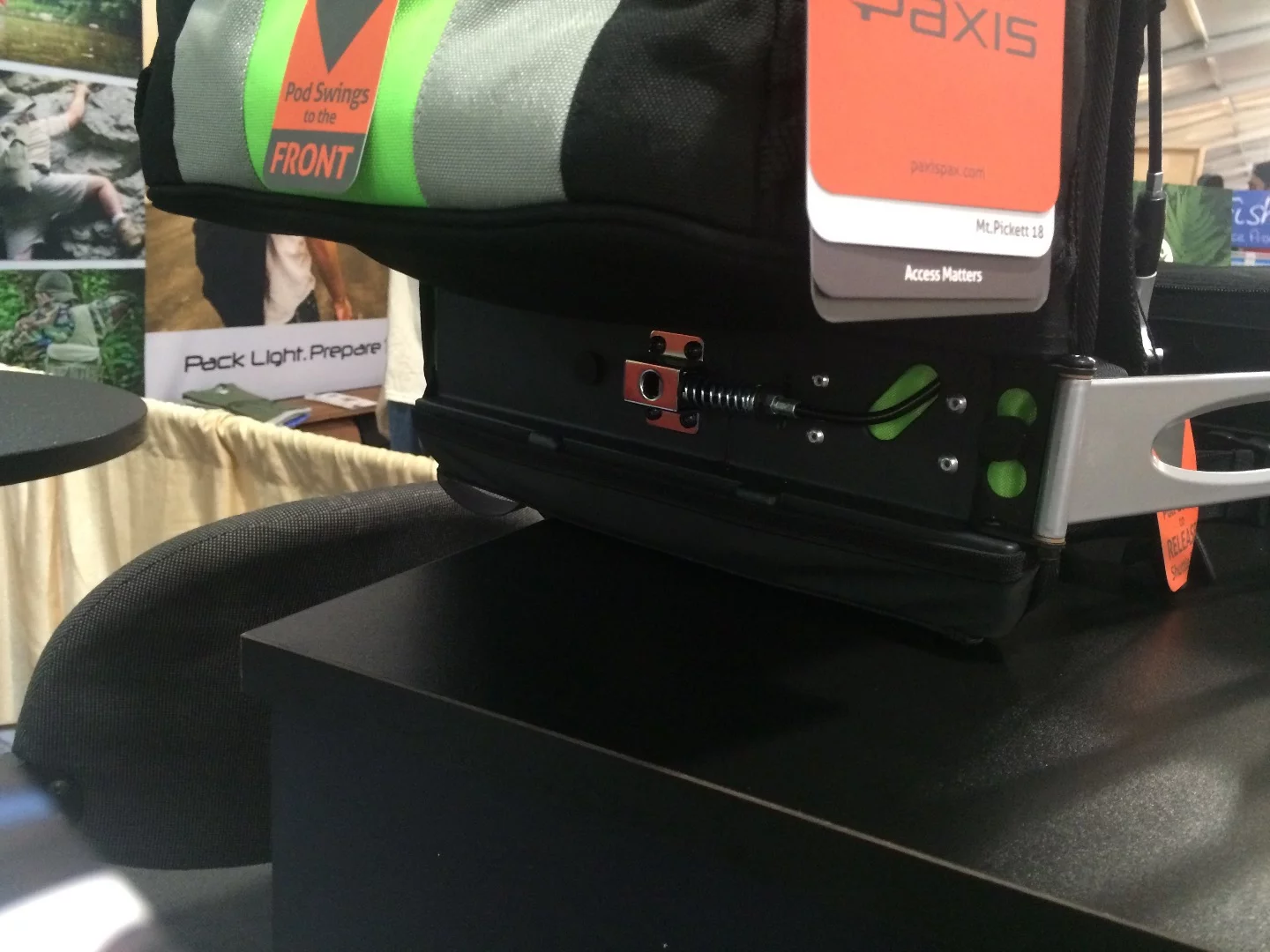 This lock secures the arm and opens with a pull of the shoulder-mounted quick release