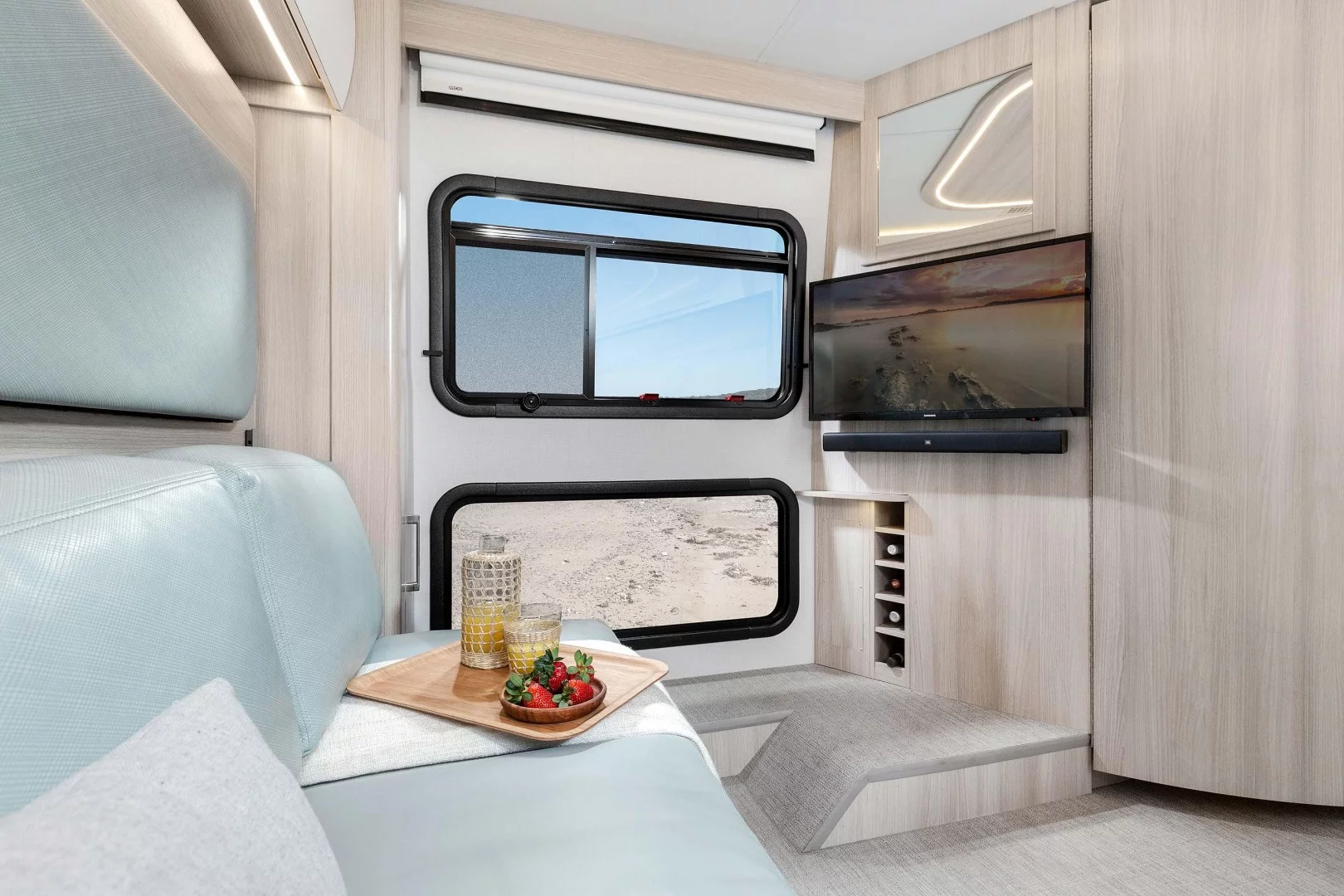 The diagonal TV/sound bar position lets campers view from the sofa or bed