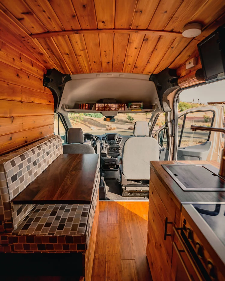 We were almost surprised they didn't keep paneling the ceiling right into the driver cab, but there is a nice little storage nook there