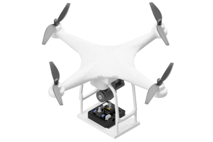 A graphic illustrating how the lab-on-a-drone was mounted on the undercarriage of a consumer quadcopter