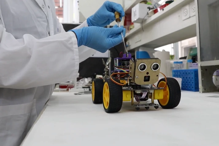 The robot receives a scented liquid, as part of its training