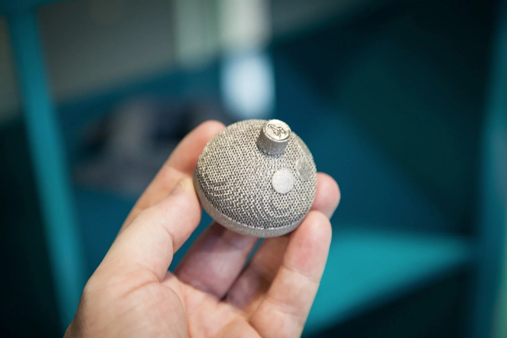3D-printed acetabular cup to replace part of the human hip joint - rough exterior surface helps the patient's bone to adhere to the titanium