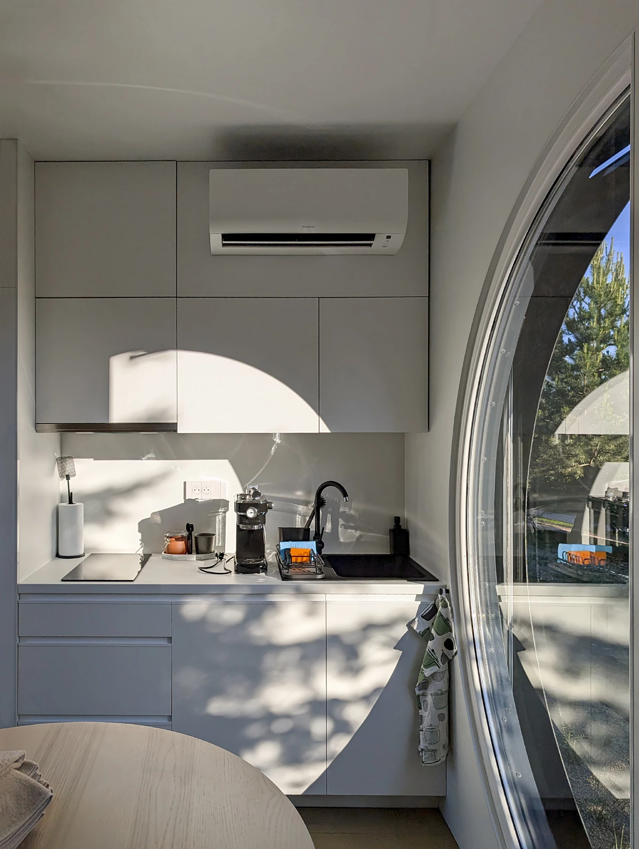 The Ecocapsule Box's kitchen is small and simple, and can optionally have additional appliances added