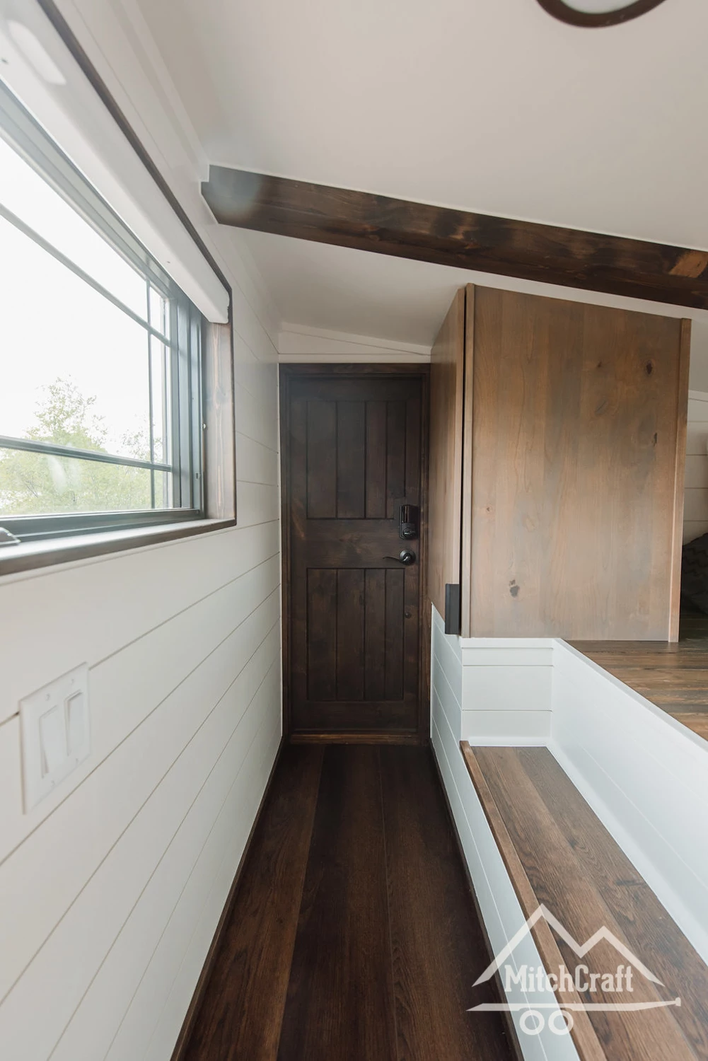 The balcony area in Lisa's 30 x 10 Tiny Home is accessed from the loft bedroom