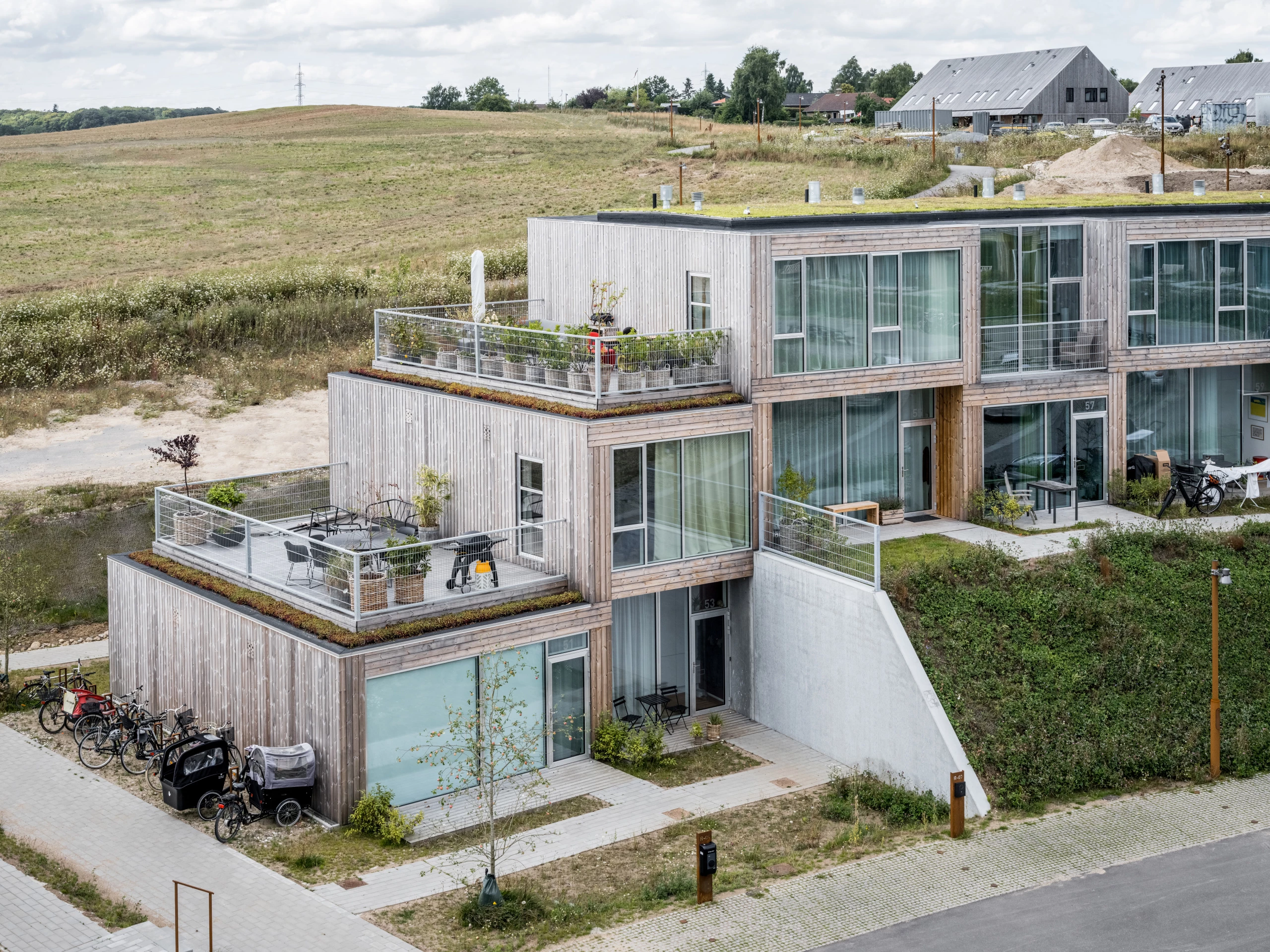 The Sneglehusene's stacked form creates a terrace area for each home