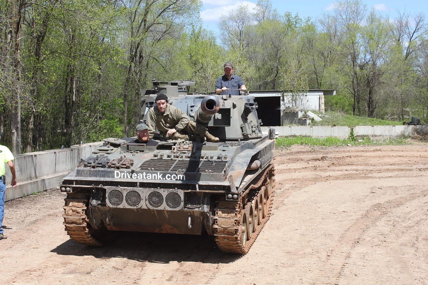 The business end of the Abbot FV433 is daunting. In the driver's seat is the author, above in the commander's position is fellow journalist Tim Esterdahl and astride the engine compartment is a Drive a Tank employee