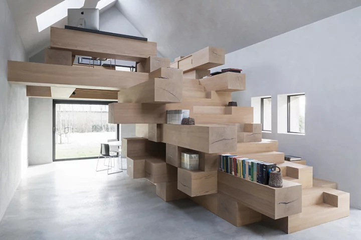 "The stacked beams become library, bookshelves, storage and resting and reading corners," says Studio Farris Architects