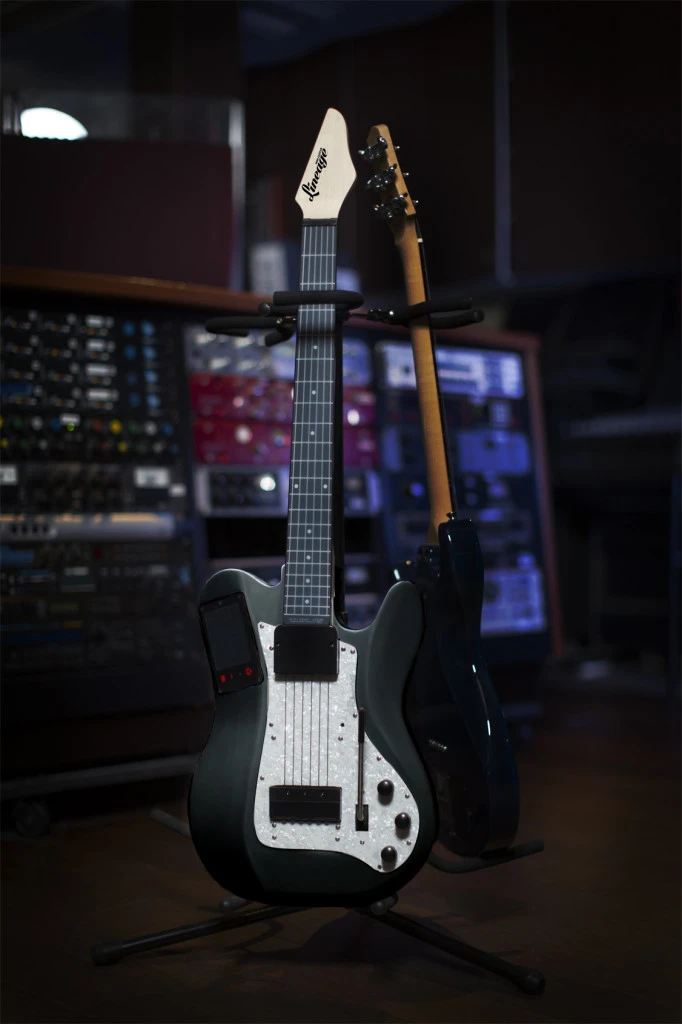 The black model of the Lineage MIDI guitar, available now for preorder