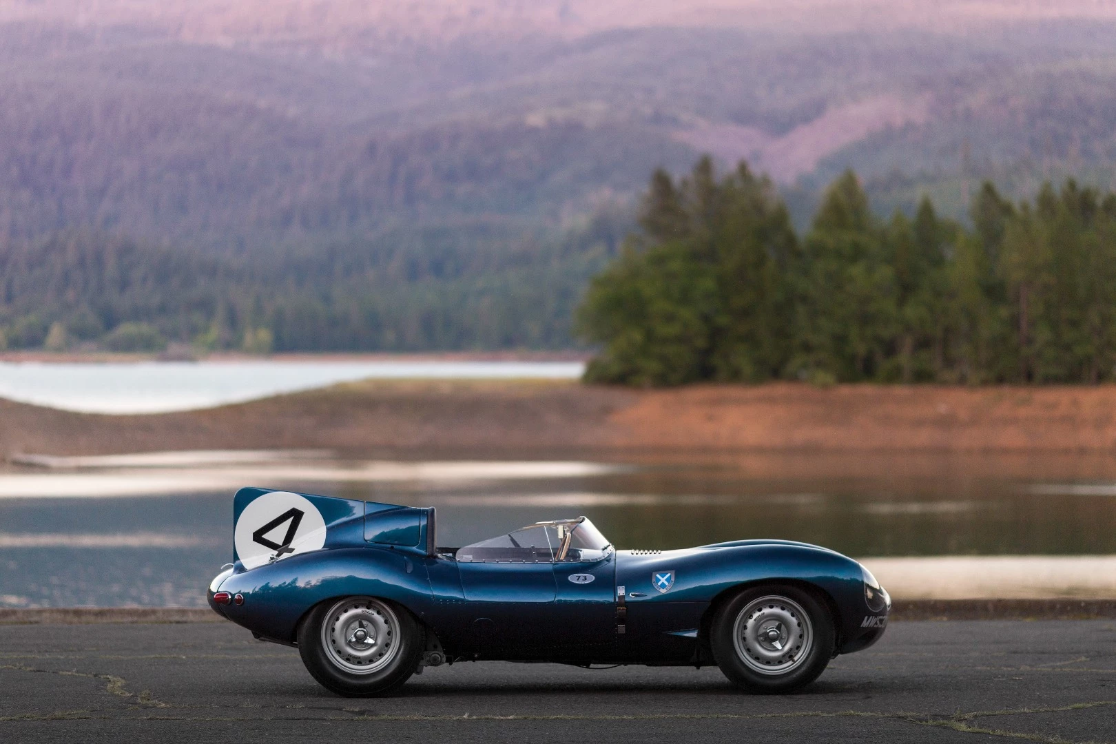 This 1955 Jaguar D-Type (chassis no. XKD 501) was the first D-Type supplied by Jaguar to a non-factory team, the famous Scottish Racing team, Ecurie Ecosse, which used it to win the 1956 24 Hours of Le Mans with drivers Ron Flockhart and Ninian Sanderson. The car spent the previous two decades in one of America's leading automotive collections prior to its sale by RM-Sothebys at Monterey, 2016 where it sold for $21,780,000 to become the most valuable British car ever to sell at auction.