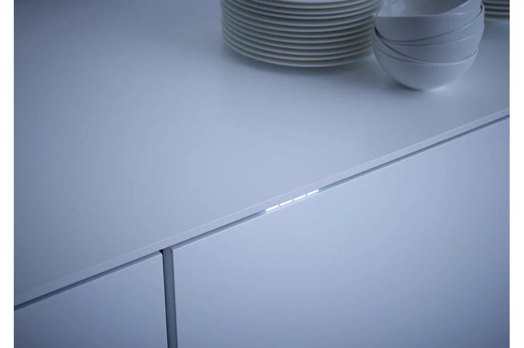 The TimeControl feature uses four edge-mounted LEDs that auto switch on when a wash cycle starts, then turn off at timed points in the program (Photo: Miele)