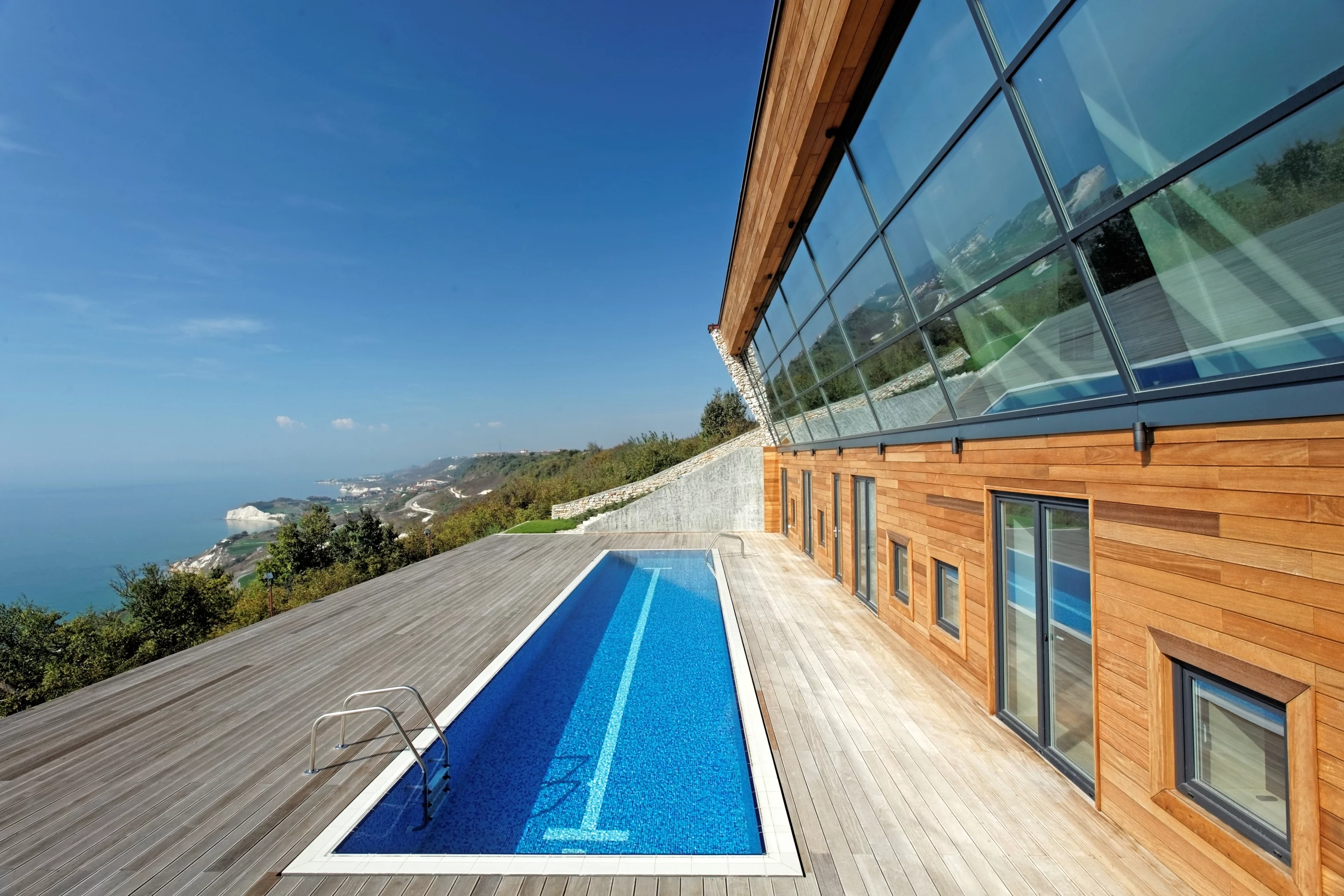 Equinox House's south-facing pool doubles as a reflector, bouncing light into the house (Photo: Ignatov Architects)