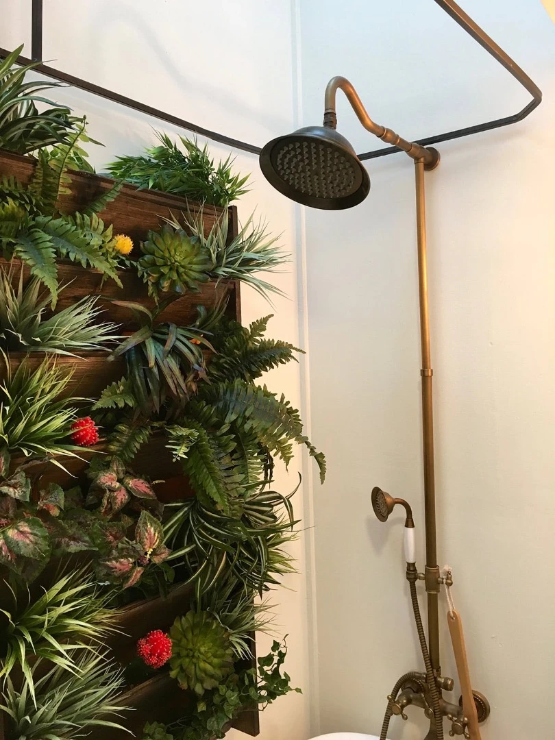 The Vintage Glam's living wall is right next to the bath